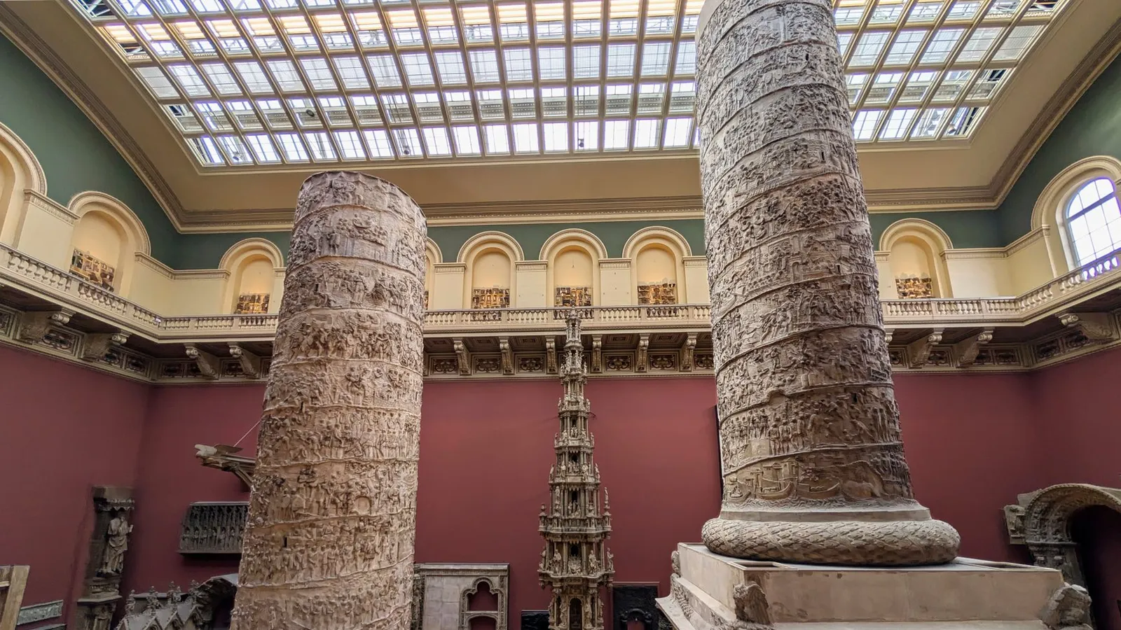 Intricate classical columns displayed in a museum's grand interior.