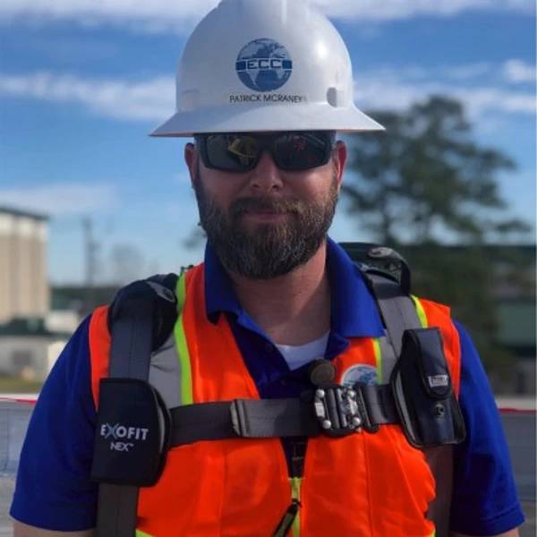 Patrick McRaney — hard hat, safety glasses, hi-vis vest, on a federal jobsite